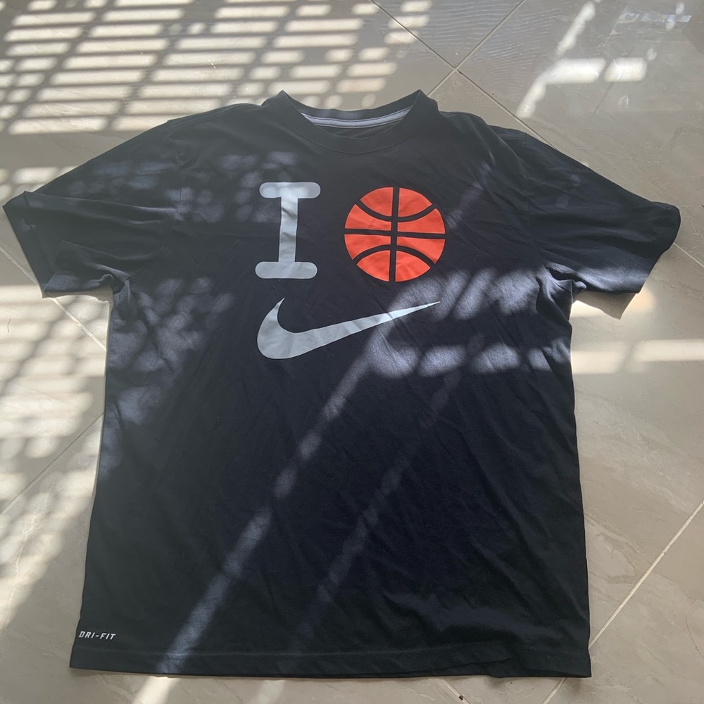 Black “I 🏀 Nike” Nike shirt.